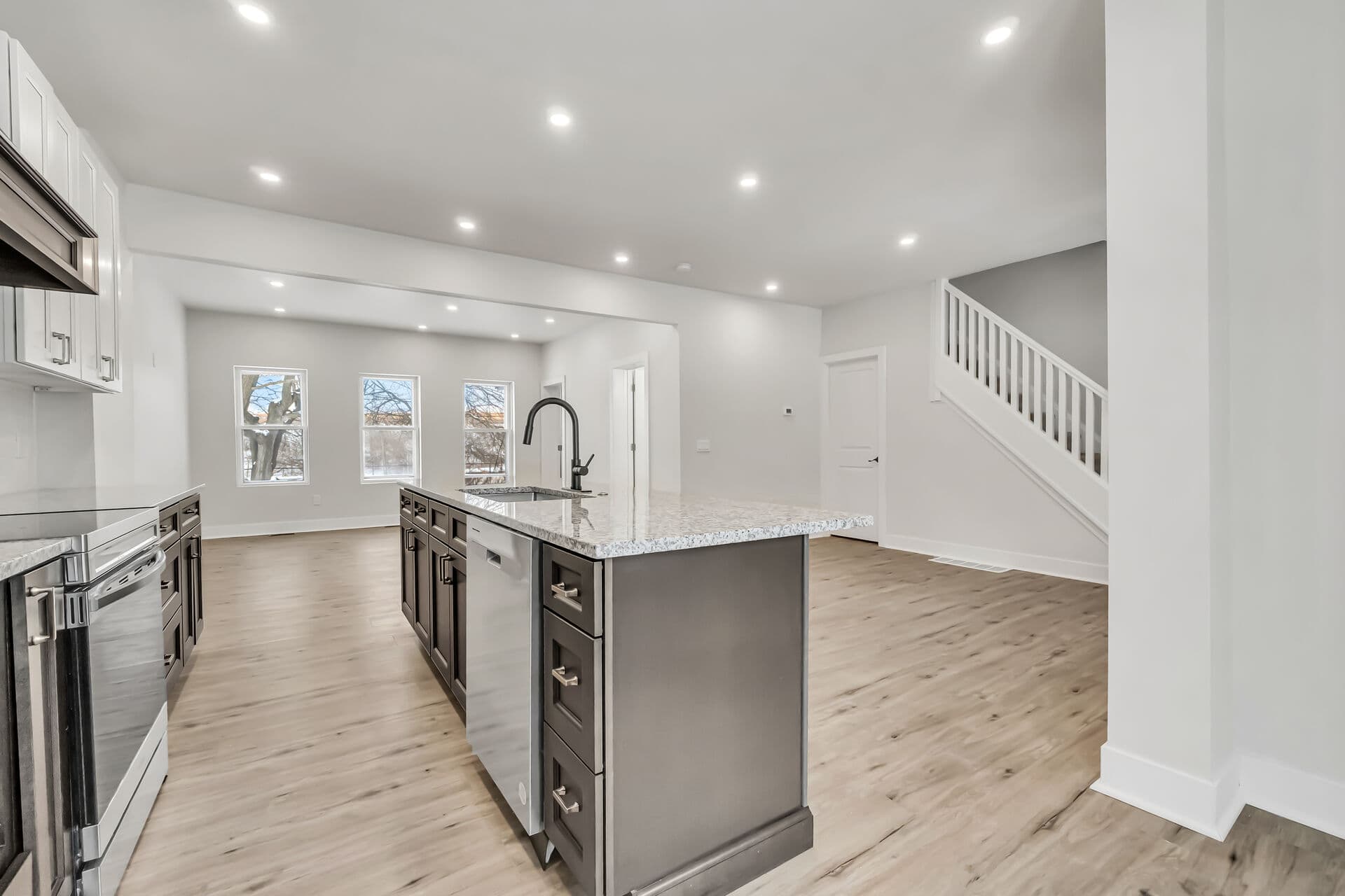 Kitchen with living room in the background